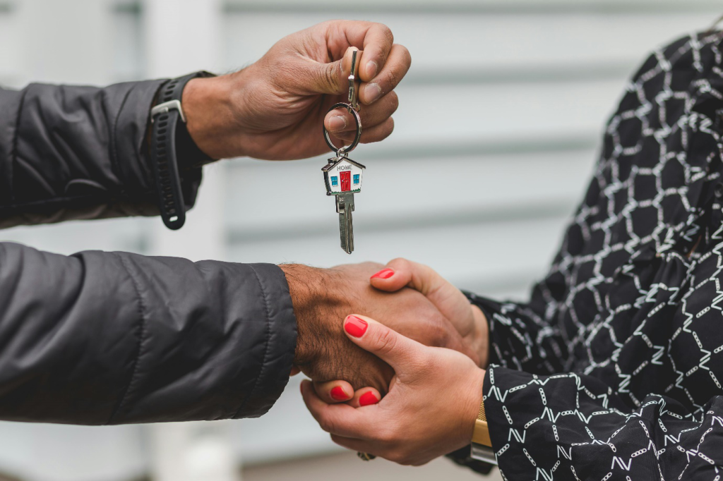 a person holding a silver key