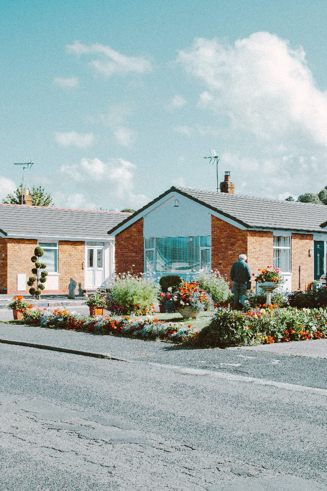 white and gray houses near road