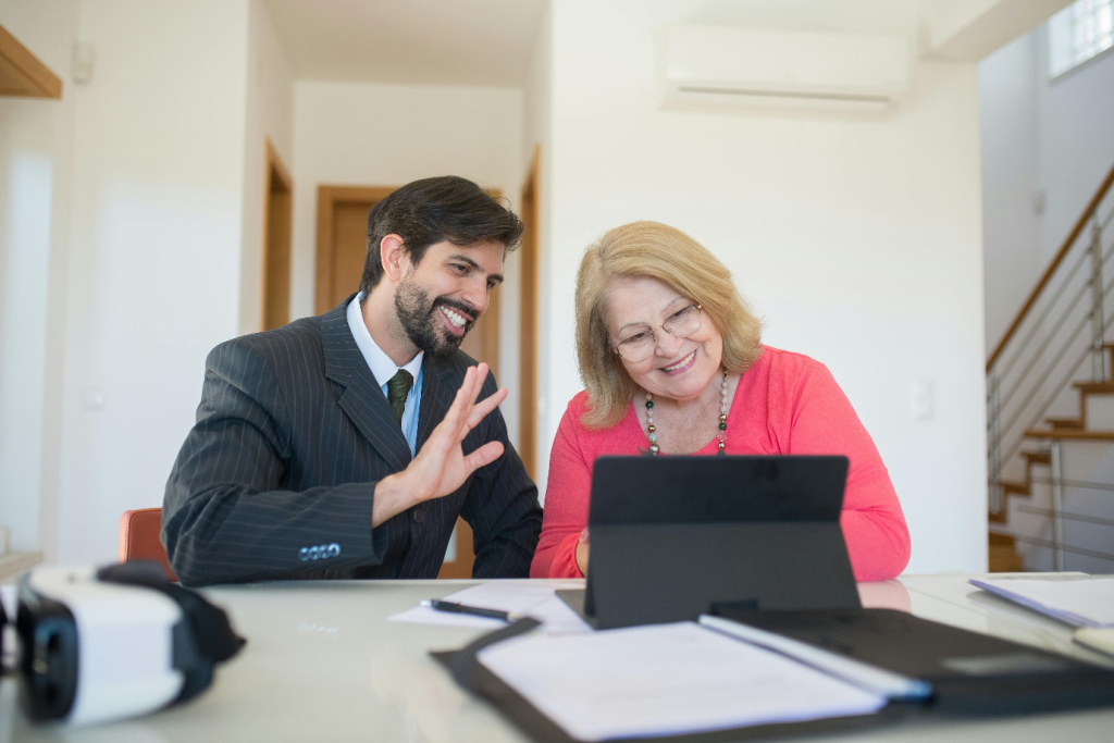 a salesman discussing real estate with a senior woman