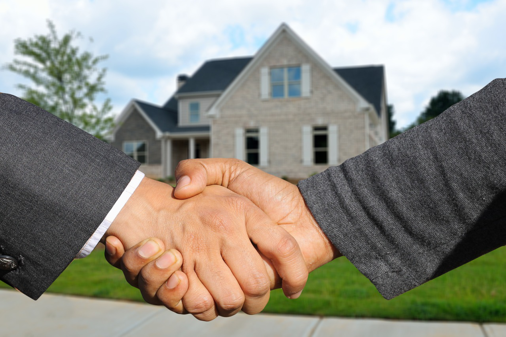 men finalizing a house purchase